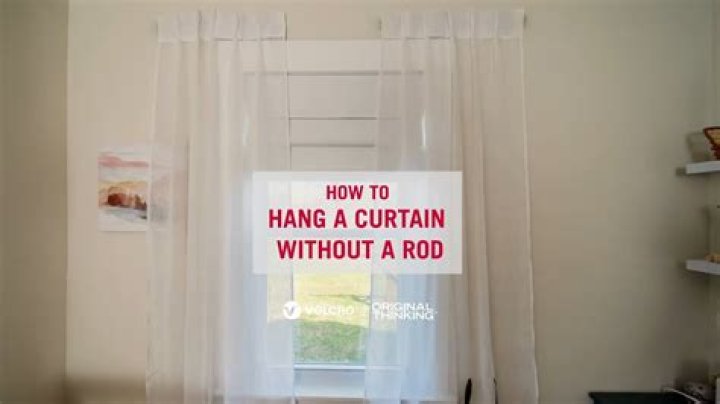 How do you hang a curtain rod on a door?