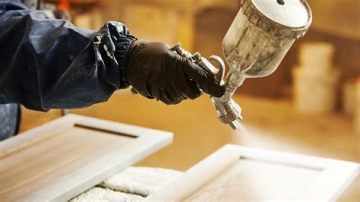 Is it better to roll or brush paint cabinets?